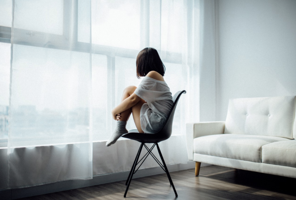 woman-looking-out-window