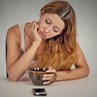 How to Get Your Ex Boyfriend Back Sad girl looking at phone