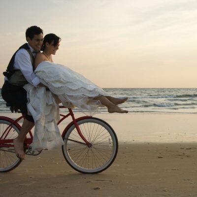 9 Ways To Get Your Spouse to Recommit To Your Marriage Newlyweds right a bike on the beach