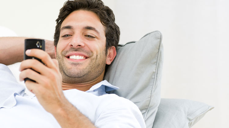 happy husband texting