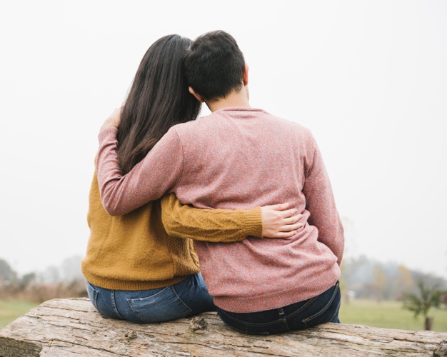 loving-couple-on-log