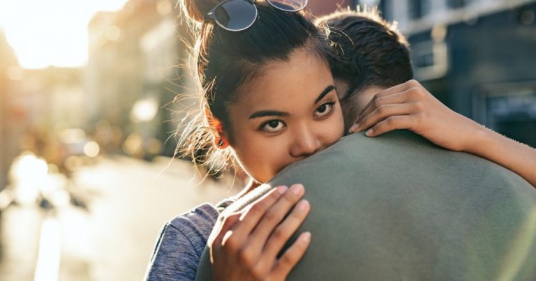 woman-hugging-man-smiling