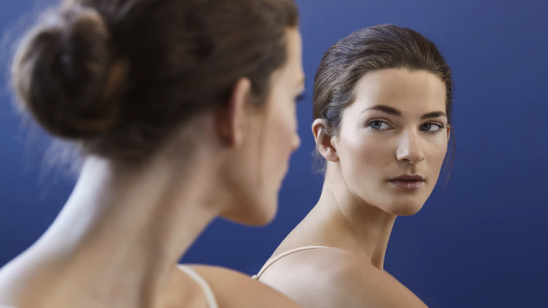 woman-looking-in-mirror