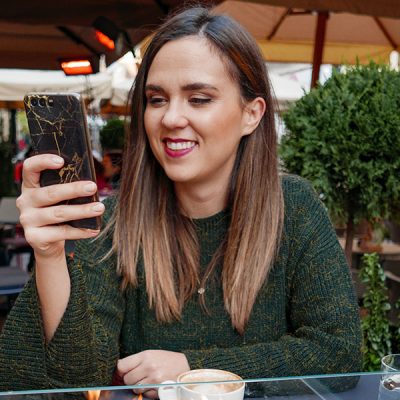 Make Your Ex Reach Out First (Build Their Interest) woman-smiling-at-phone