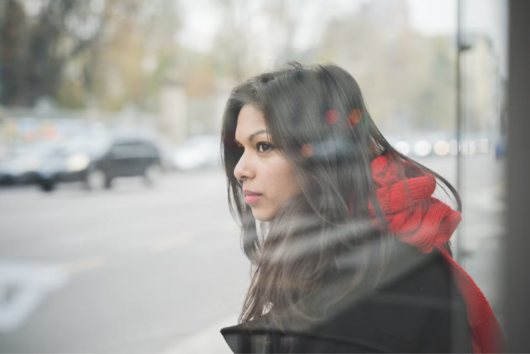 woman-looking-through-window