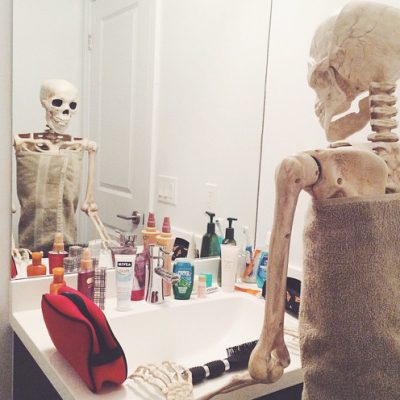 Signs Your Ex Is Hurting skeleton-woman-looking-in-mirror