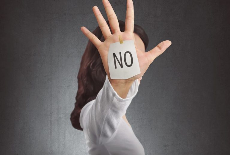 woman-with-hand-covering-face-with-no-written-on-it