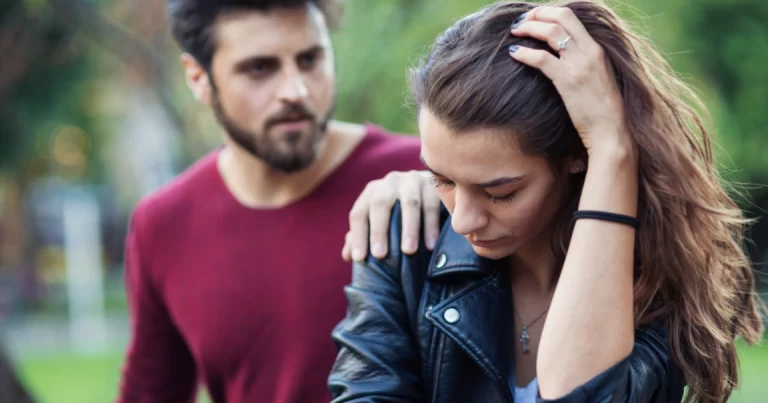 man-touching-womans-shoulder